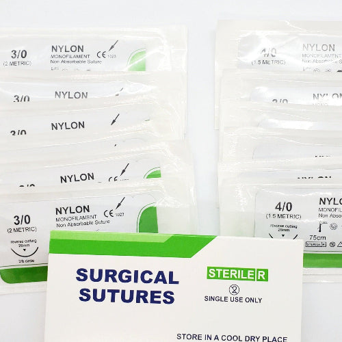Box of surgical sutures with nylon material, indicating single use only and sterilized.