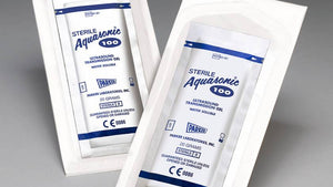 Two sealed sterile foil pouches of Aquasonic 100 Ultrasound Gel, placed against a light background.