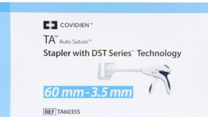 Stapler packaging with COVIDIEN branding and product details on a light blue and white background