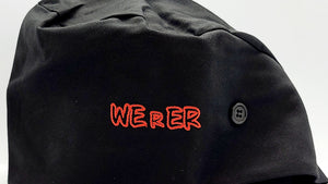 A black surgical scrub cap with red embroidered text 'WEIR' on the front and buttons for fastening.