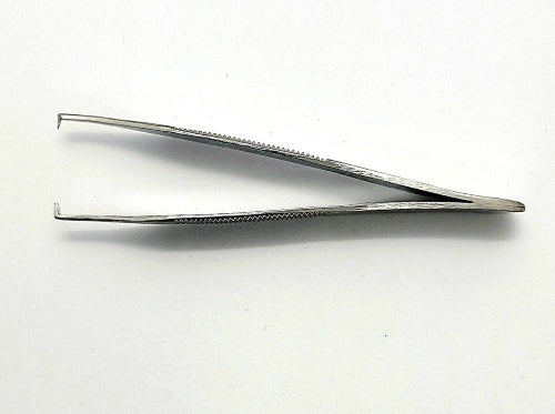A stainless steel Adson tissue forceps with serrated grip and teeth used for compressing tissues.
